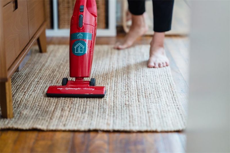 A carpet being deep cleaned with a vacuum cleaner
